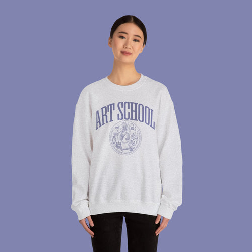 Person wearing a gray sweatshirt with 'AMOR' and a heart design on a white background